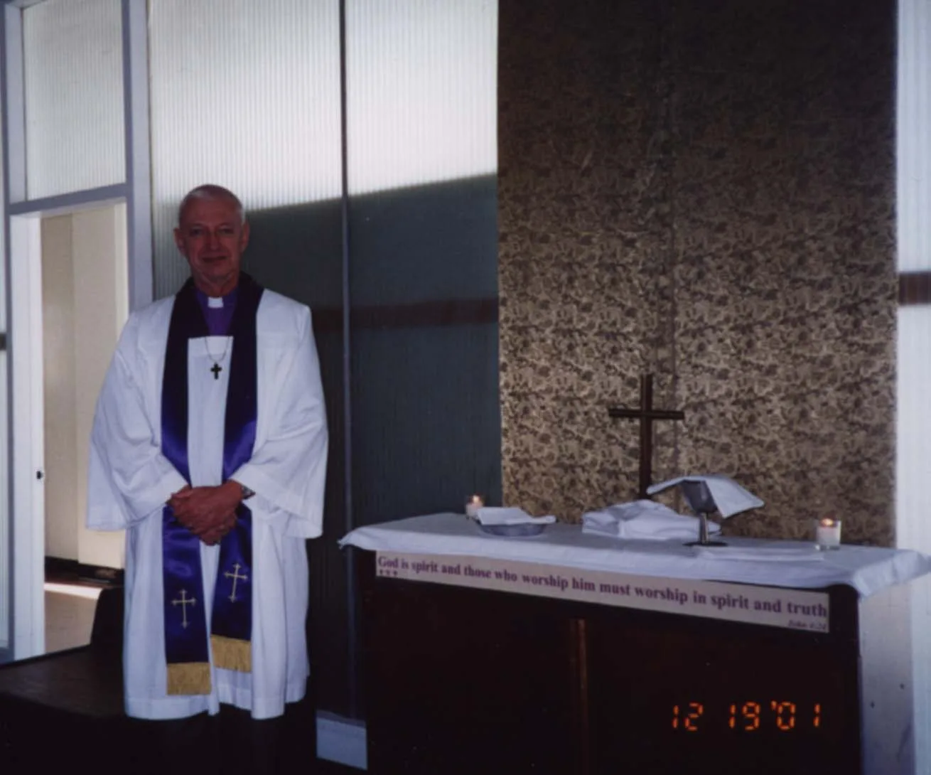 The Most Reverend Edwin Duane Follick in a chapel. Date unknown.